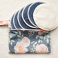 Reusable organic bamboo nursing pads in floral carrying pouch from Fourth Trimester Mama