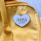 Mama enamel pin from Fourth Trimester Mama on a diaper bag
