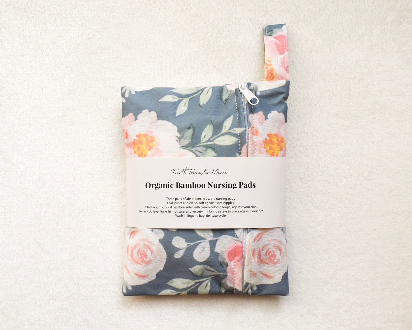 Reusable organic bamboo nursing pads in floral carrying pouch from Fourth Trimester Mama