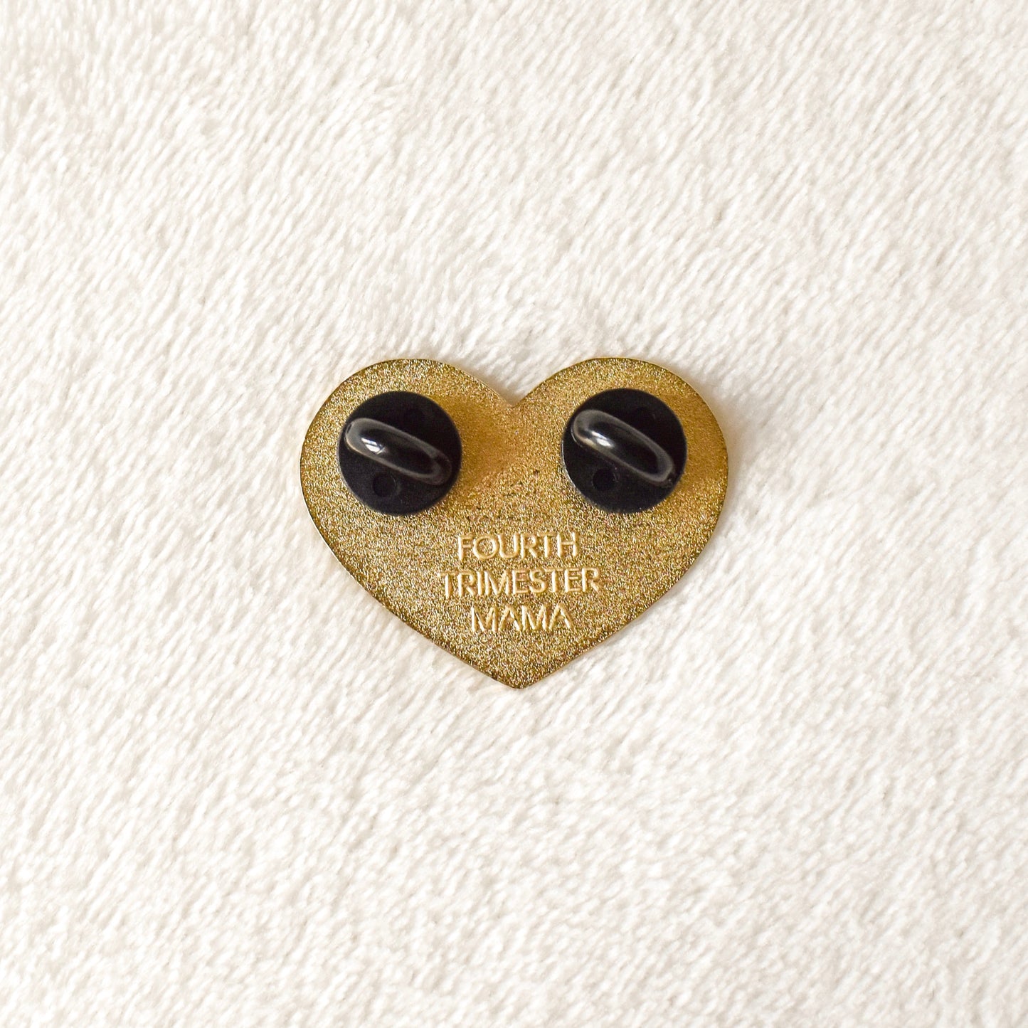 Back of a Mama enamel pin from Fourth Trimester Mama