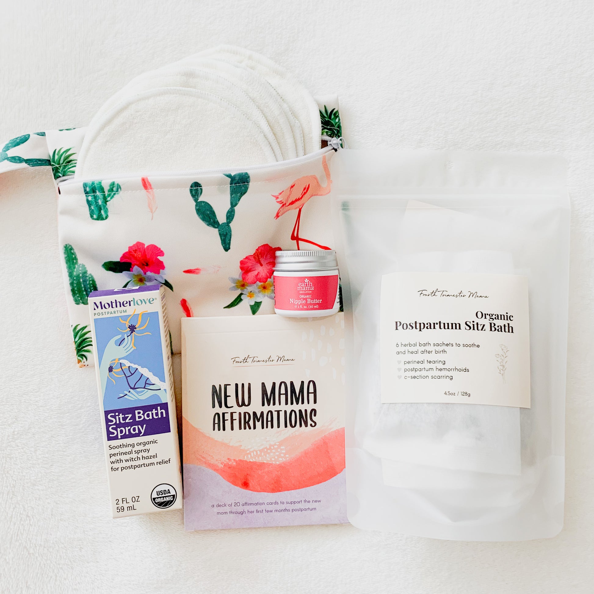 Postpartum Care Package from Fourth Trimester Mama featuring postpartum essentials including nursing pads, sitz bath, affirmation cards, nipple butter, and perineal spray