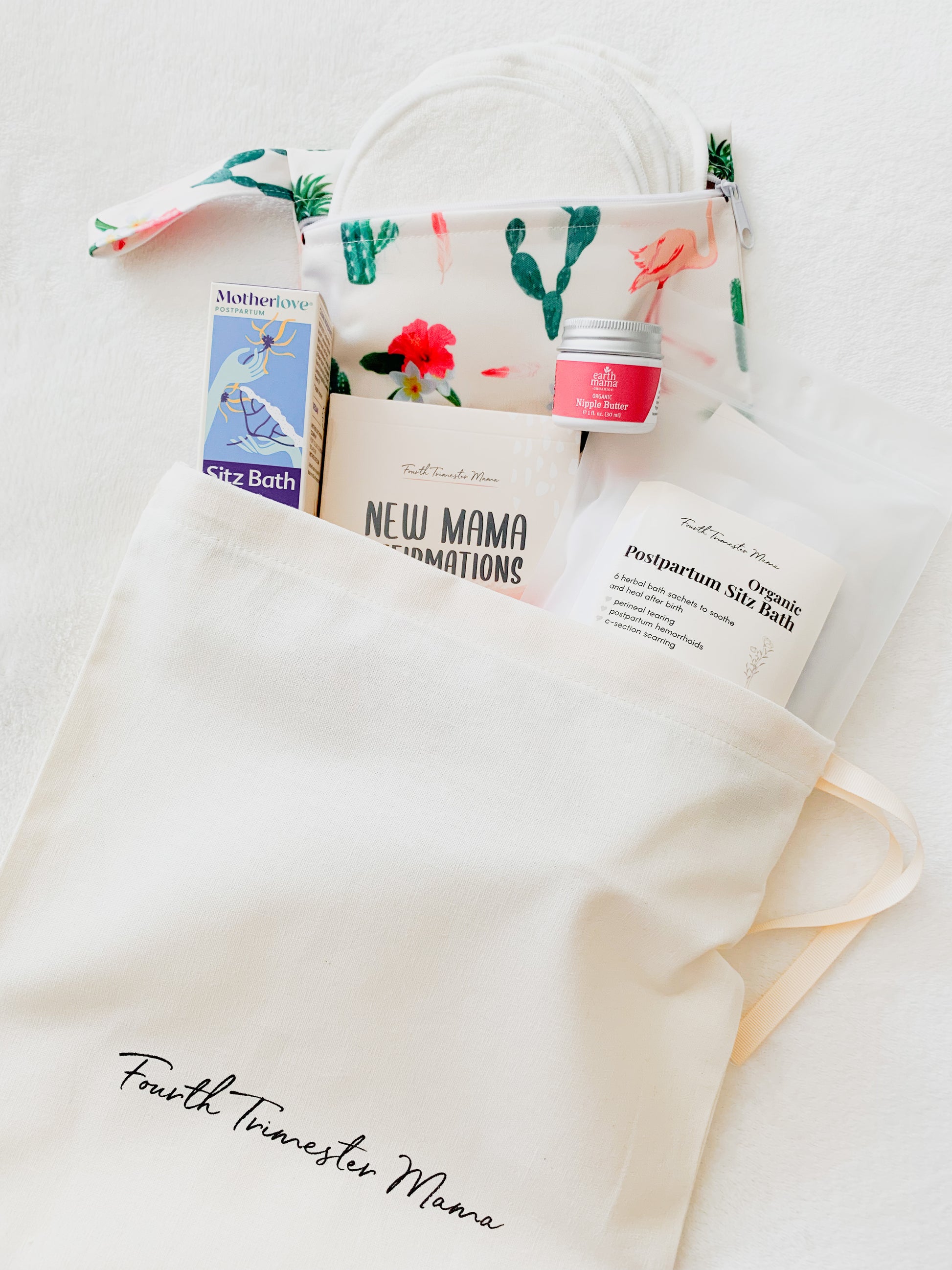 Postpartum Care Package from Fourth Trimester Mama featuring postpartum essentials including nursing pads, sitz bath, affirmation cards, nipple butter, and perineal spray